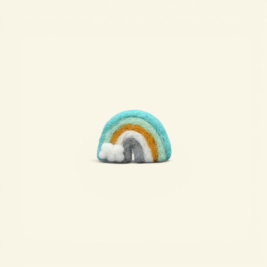 handmade wool felt rainbow brooch, mint colorway — teal, mint and marigold arches with a tiny white cloud, needle-felted in nepal