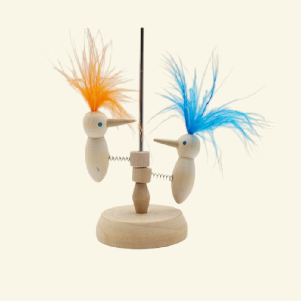 the pecking order – wooden pecking bird toy, orange and blue feather color examples, uggaz