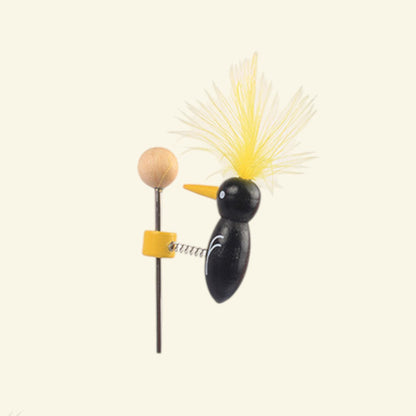 the pecking order – close-up of the wire coil clip and wood ball handle, black body yellow feather, uggaz