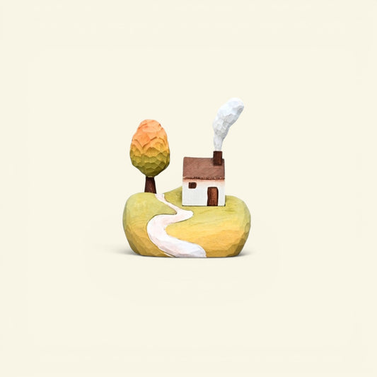 hand-carved basswood hillside cottage — tree, path and chimney smoke, hand-painted in nepal