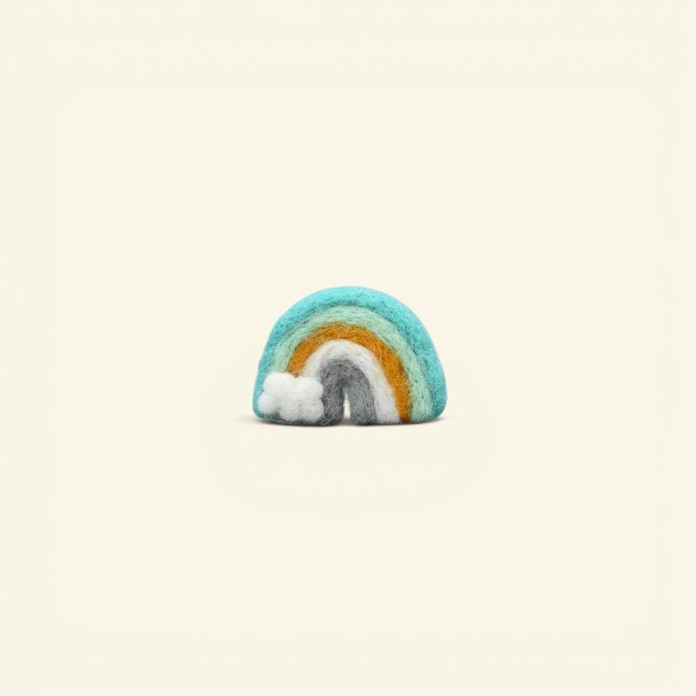 handmade wool felt rainbow brooch, mint colorway — teal, mint and marigold arches with a tiny white cloud, needle-felted in nepal