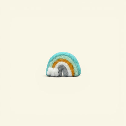 handmade wool felt rainbow brooch, mint colorway — teal, mint and marigold arches with a tiny white cloud, needle-felted in nepal