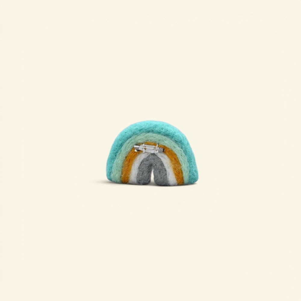 wool felt rainbow brooch with hand-felted cloud, about 2.4 inches wide — detail of the needle-felted arches