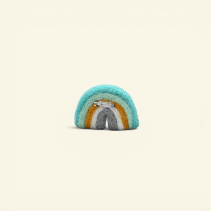 wool felt rainbow brooch with hand-felted cloud, about 2.4 inches wide — detail of the needle-felted arches