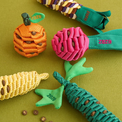 The Knot Harvest tangerine and dragon fruit toys with treats tucked into the rope weave