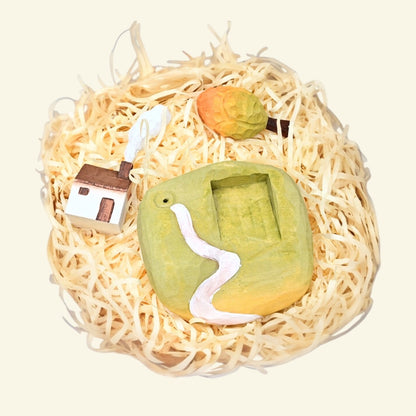 hand-carved and hand-painted basswood — each cottage varies piece to piece, no two alike