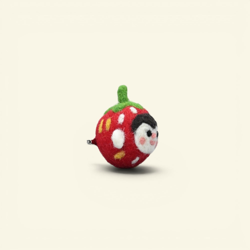 needle-felted wool strawberry brooch handmade in nepal — each one felted individually, no two alike