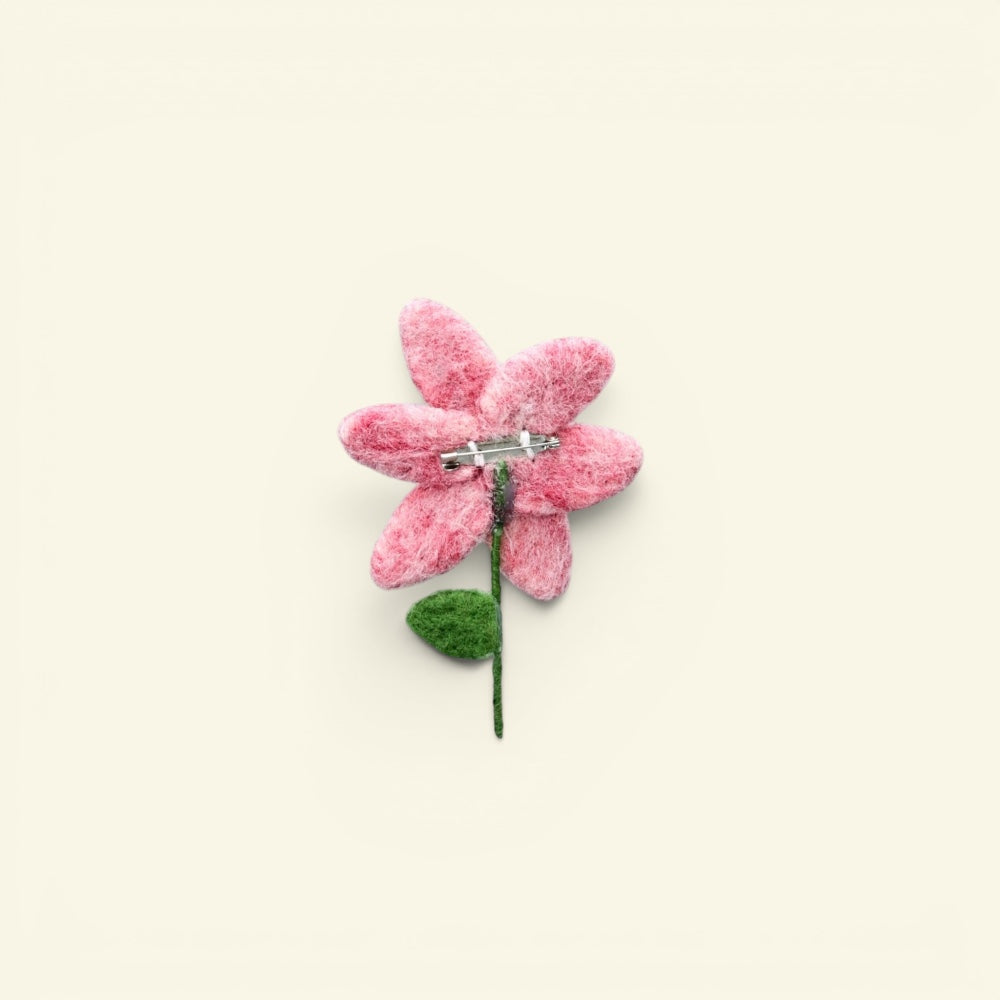 wool felt pink flower brooch detail — hand-needled petals in mottled pink wool