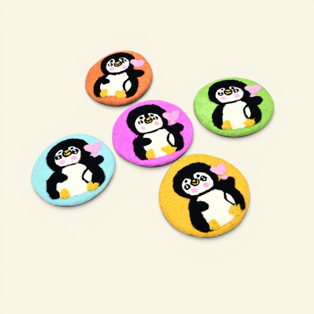 wool felt penguin coaster, about 3.9 inches round — handmade in nepal, not heatproof