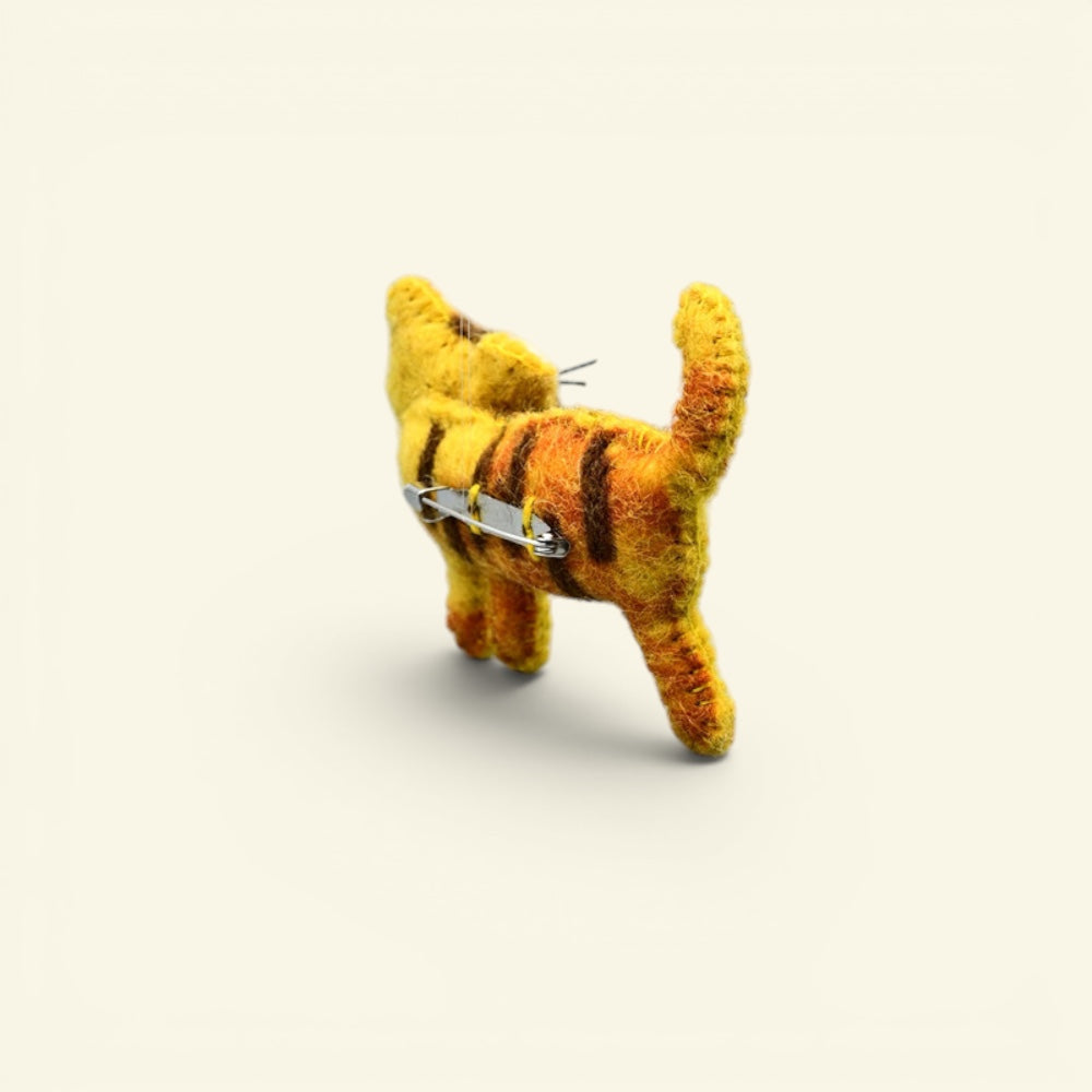 wool felt tiger brooch detail — hand-needled stripes and stitched whiskers