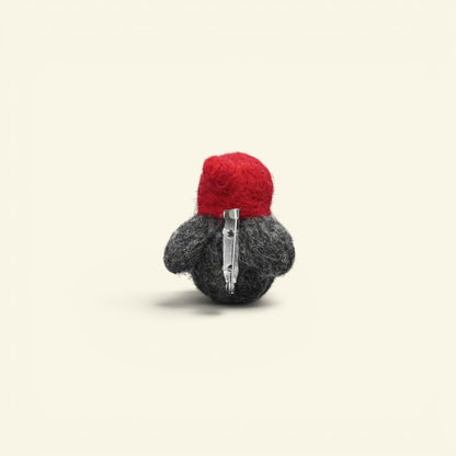 needle-felted wool penguin brooch handmade in nepal — each one felted individually, no two alike
