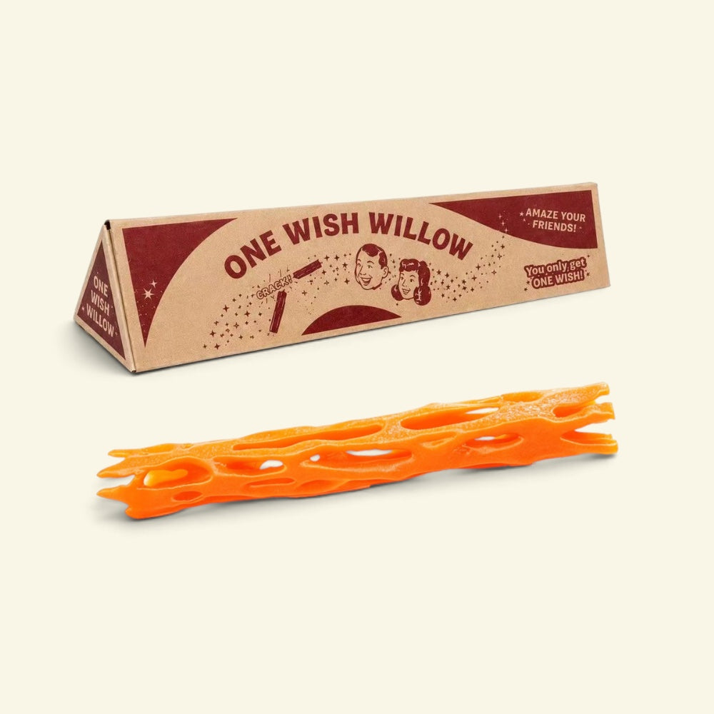 orange one wish willow lattice snap stick beside its triangular printed box