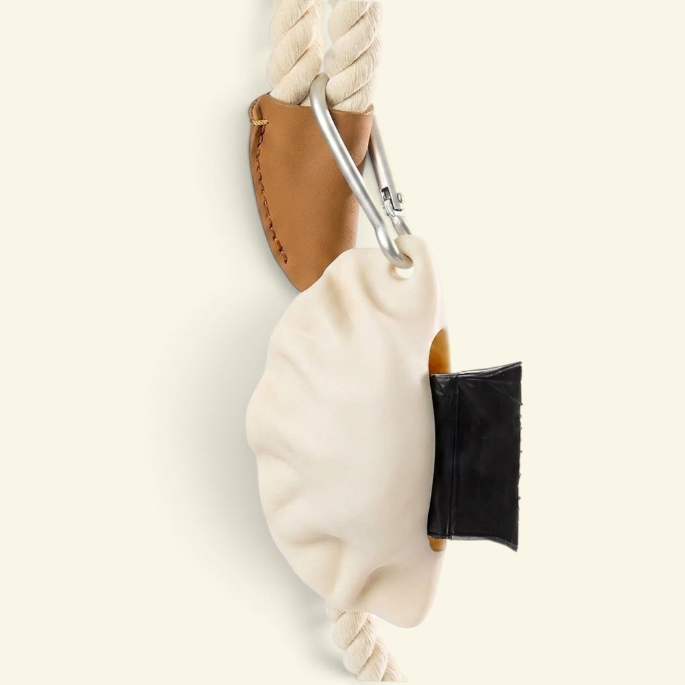 the dumpling dispenser clipped to a rope leash handle via carabiner
