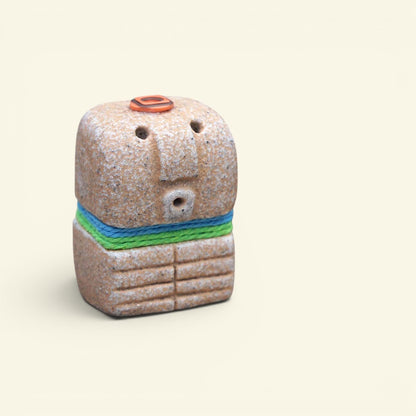 the dressed up – plain, hand-trimmed bali stone-look resin figurine, uggaz