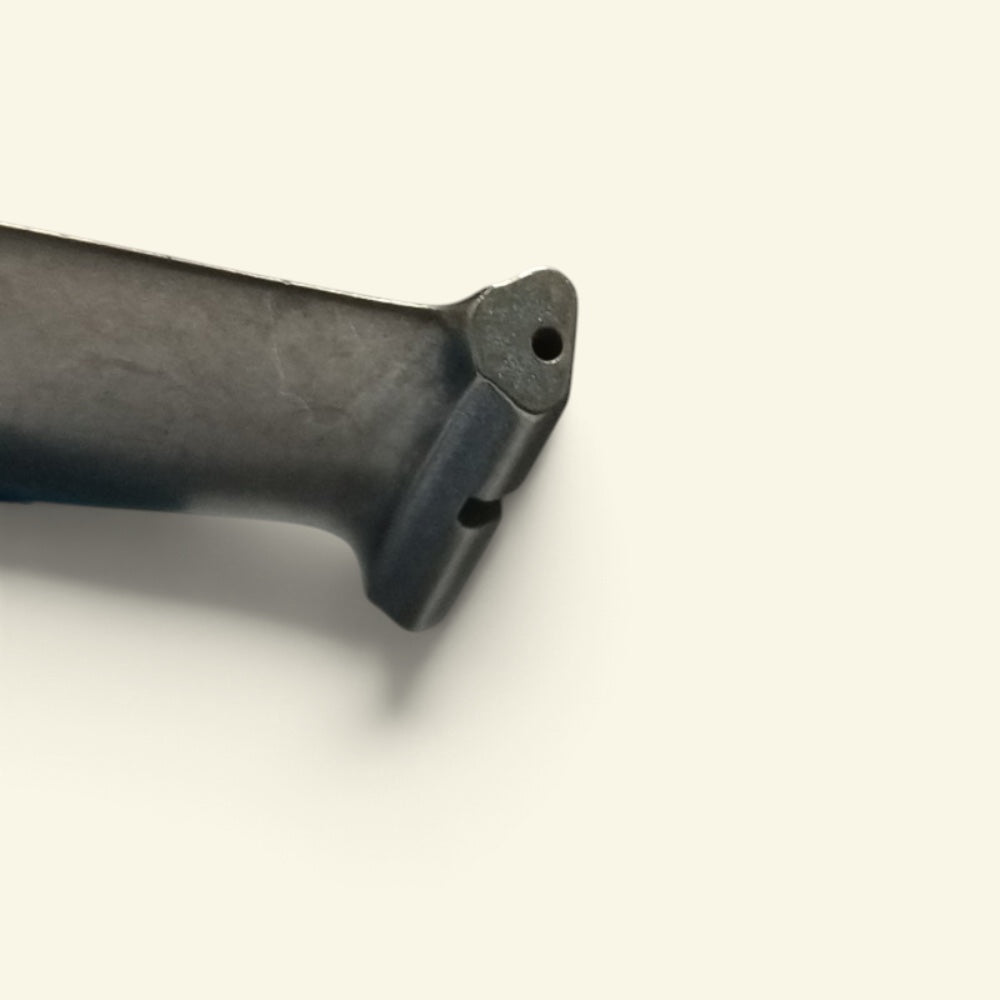 the blade root from another angle, with the small air hole at its base