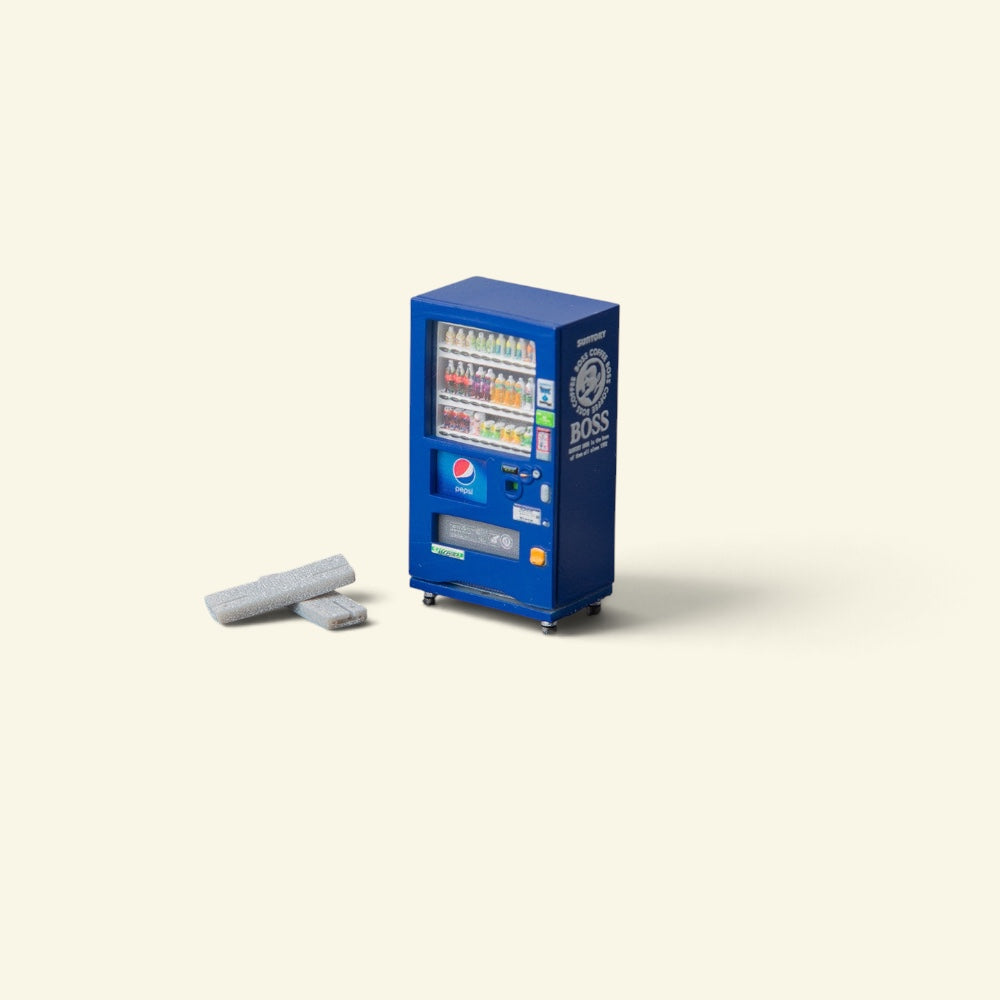 blue 1:64 scale vending machine in hand-painted resin, rows of tiny sculpted bottles behind the glass, two small grey blocks beside it