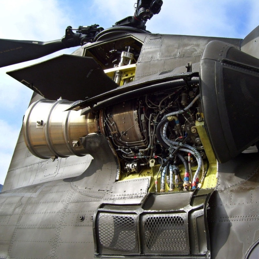a ch-47 chinook helicopter with its engine cowling open, showing the t55 turboshaft engine