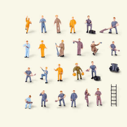 25-piece 1:87 worker set laid out on a cream background: 23 painted workers with shovels and tools, a ladder and a small cart