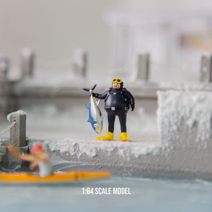 wider view of the 1:64 diver on a dock scene with water and a kayaker below (diorama not included)