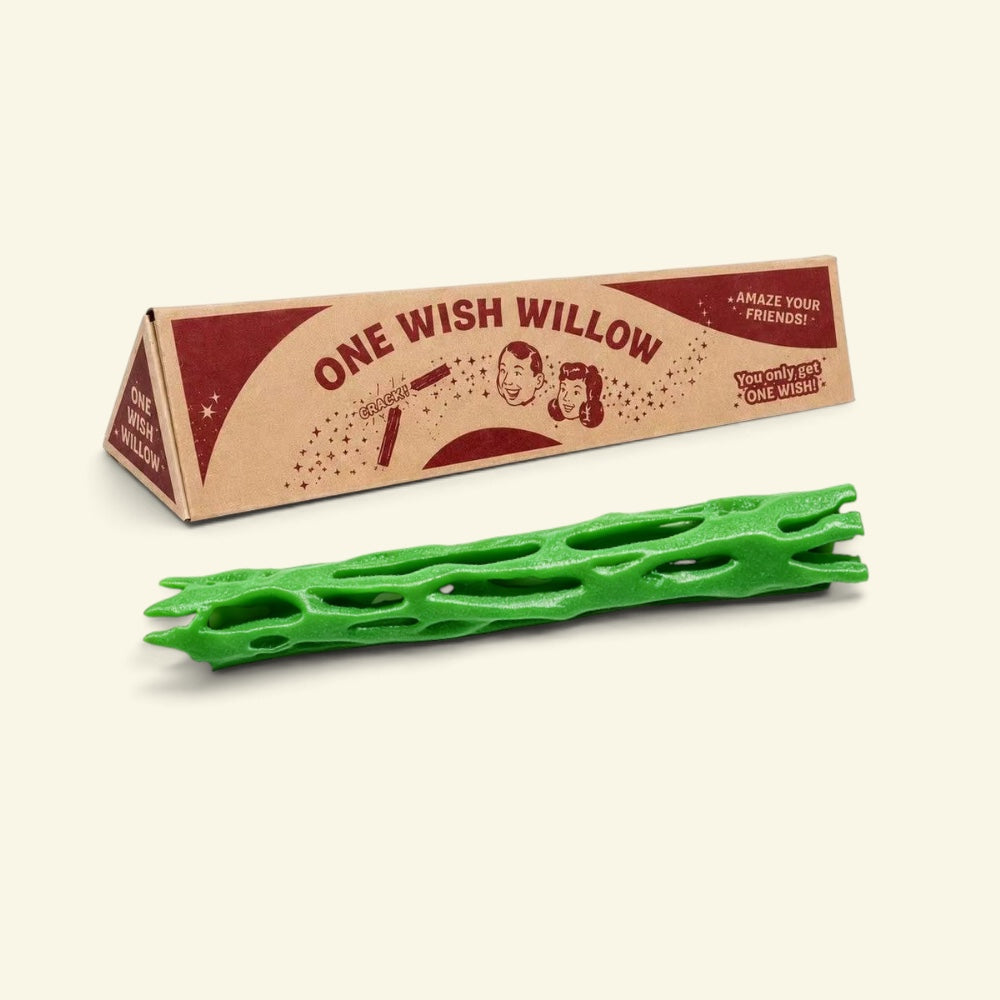 green one wish willow lattice snap stick in front of its triangular printed box