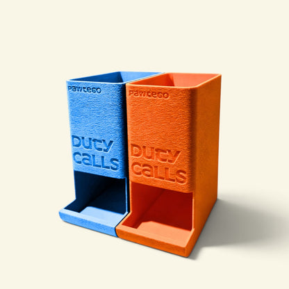 empty blue and orange Duty Calls dispenser boxes side by side with no lids and no bags, showing the open top and front dispensing slot