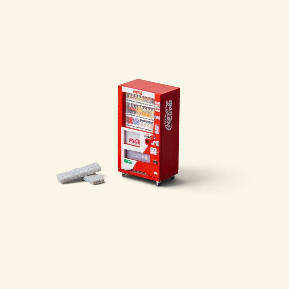 red 1:64 scale vending machine in hand-painted resin, rows of tiny sculpted bottles behind the glass, two small grey blocks beside it