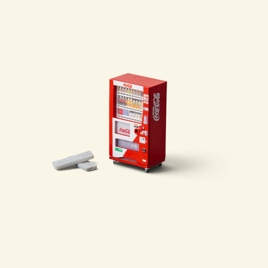 red 1:64 scale vending machine in hand-painted resin, rows of tiny sculpted bottles behind the glass, two small grey blocks beside it