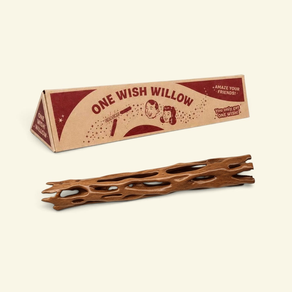 brown wood-toned one wish willow snap stick in front of its triangular printed box