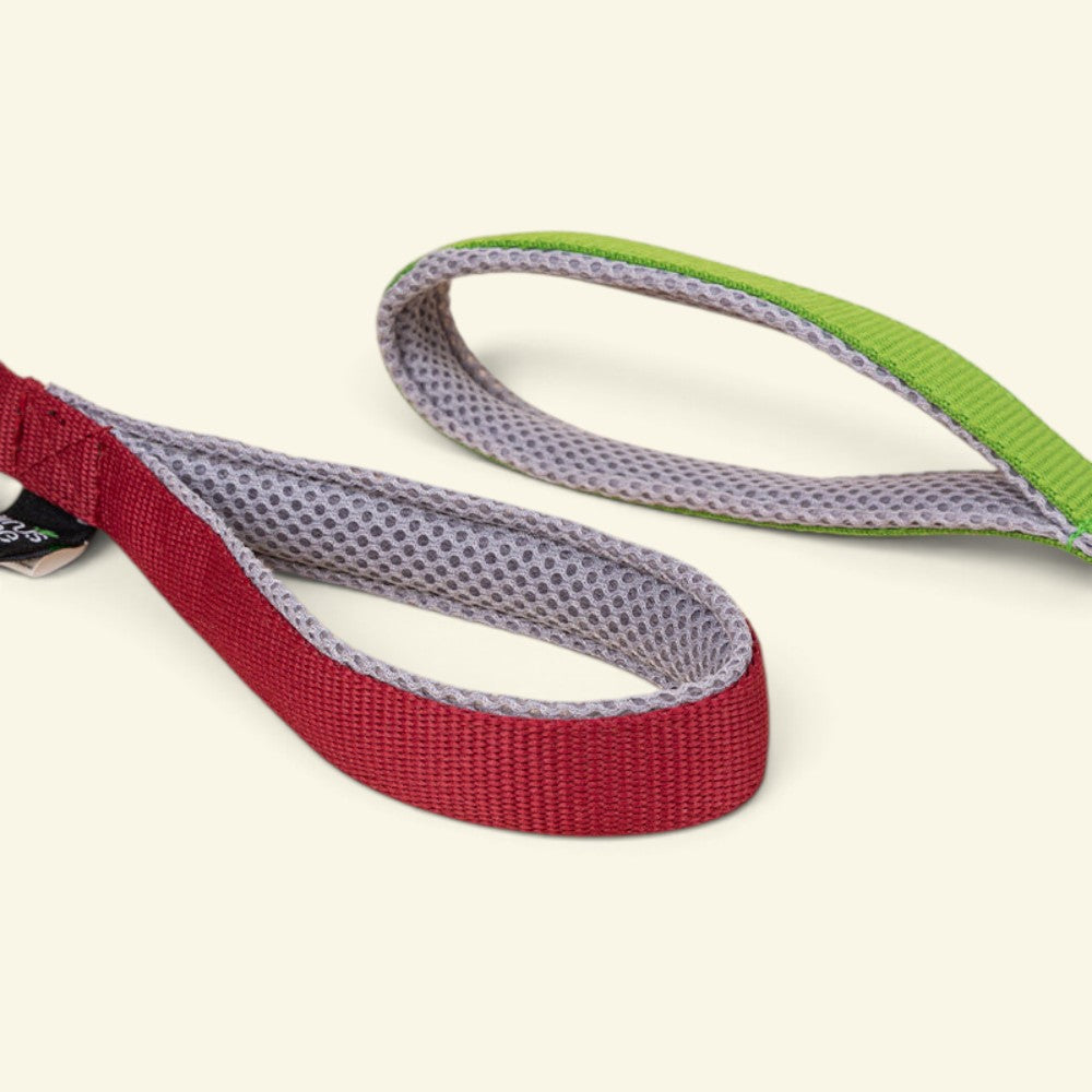 webbing handle close-up on the UggaZ fleece tug rope, green and red/gray