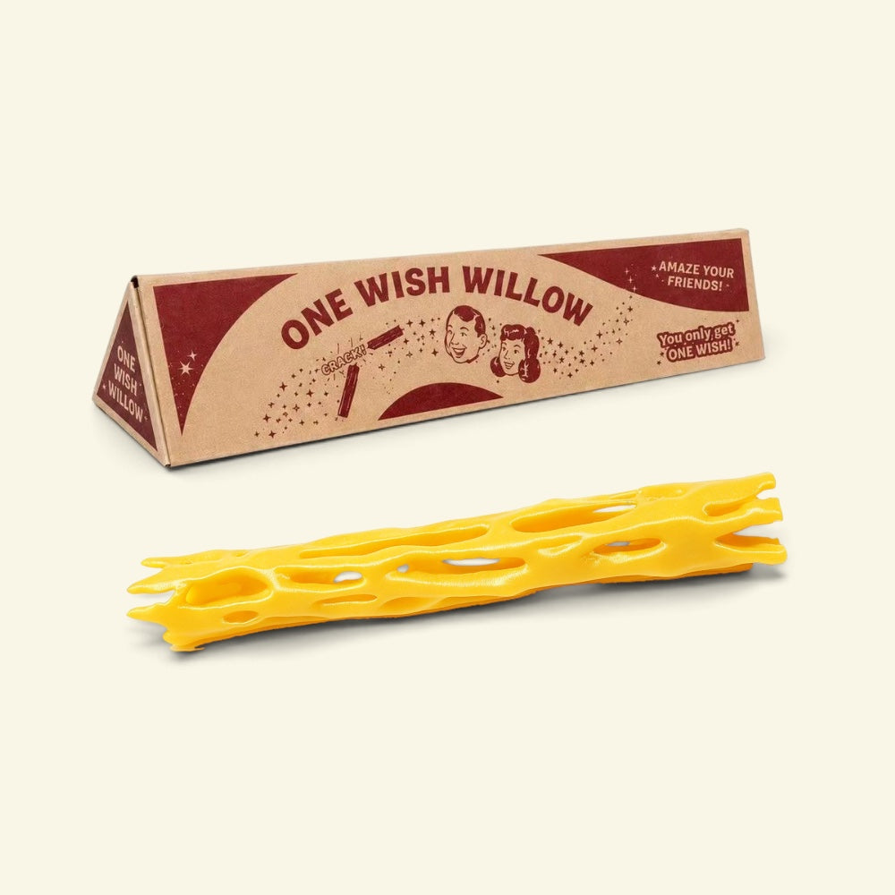 yellow one wish willow lattice snap stick beside its triangular printed box