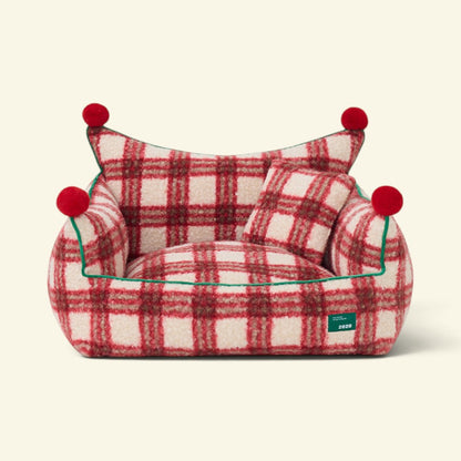 the plaid throne – fuzzy red and cream plaid pet sofa bed with a crown-shaped back and a small plaid pillow, uggaz