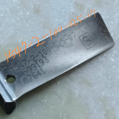 close-up of a marked blade from the same batch, stamped with part number 1-547-2-100-025-07 — the unmarked kind has this stamp polished off