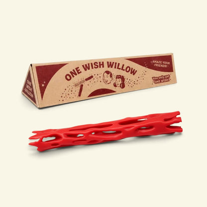 red one wish willow lattice snap stick in front of its triangular printed box
