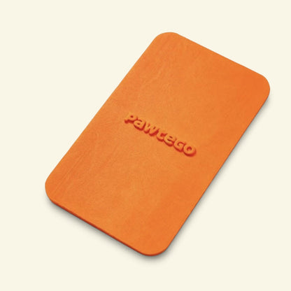 orange Duty Calls lid on its own, top-down view showing the embossed Pawtego logo