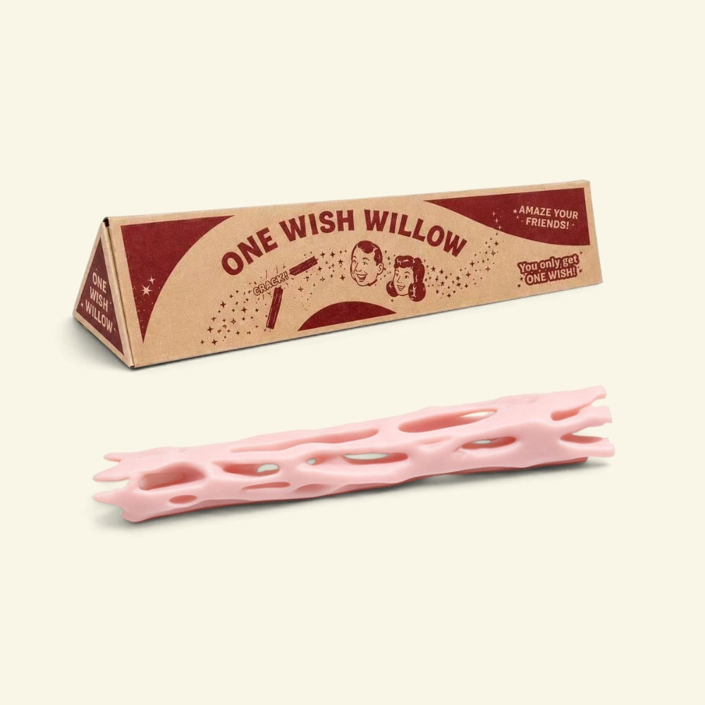 pink one wish willow lattice snap stick in front of its triangular printed box