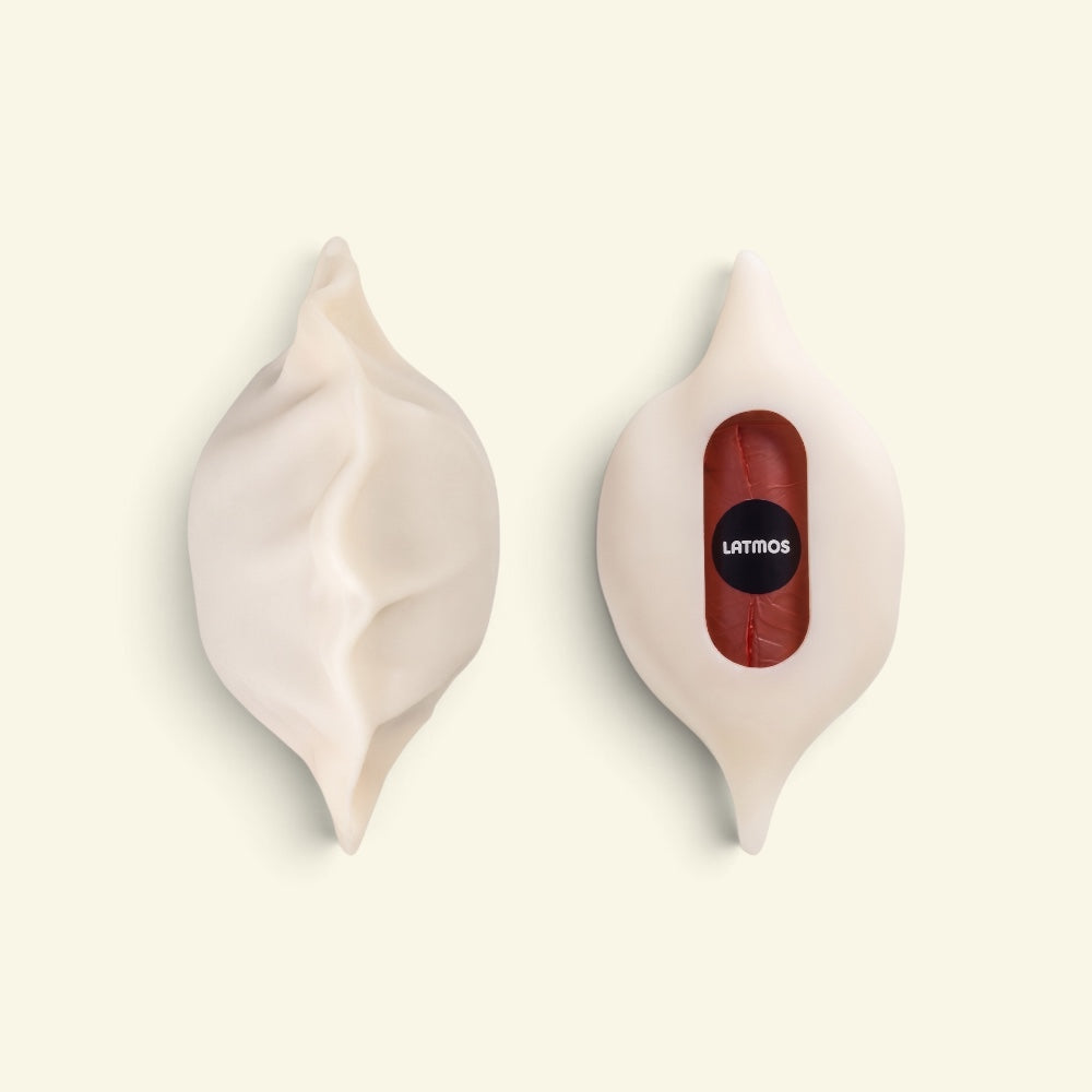 front and back of the dumpling silicone poop bag dispenser, studio shot