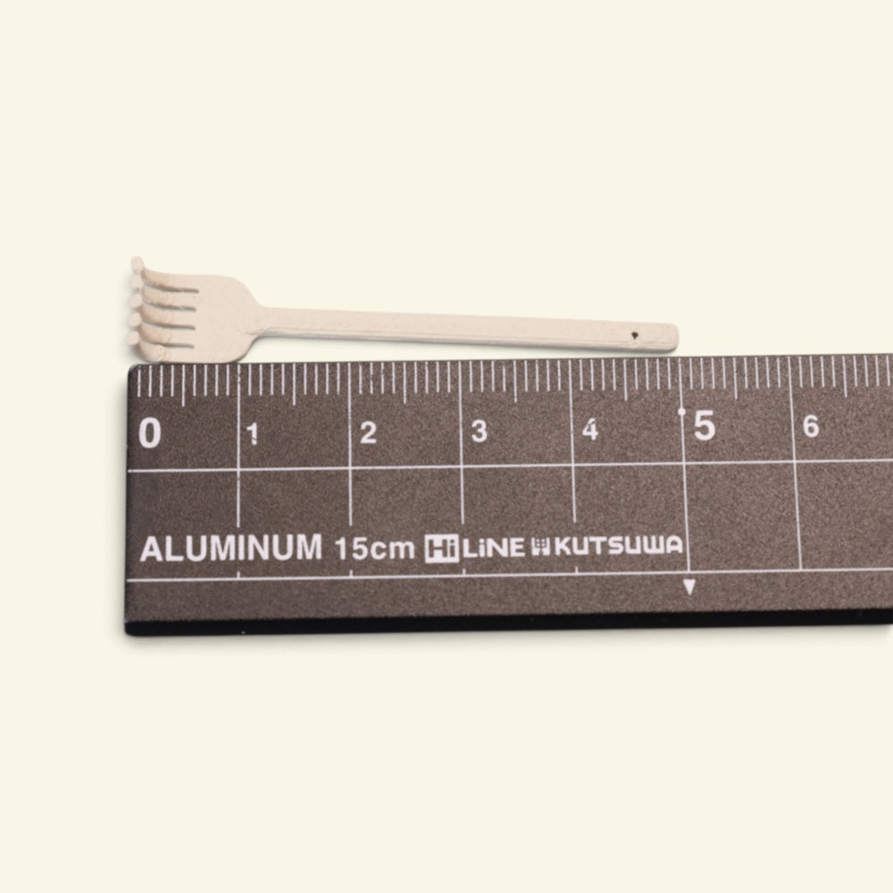 the tiny back scratcher measured against a ruler, just over 5 cm from claw tip to handle, uggaz