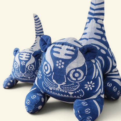 the indigo tiger – hand-drawn batik cloth tiger, indigo and white, small and large, size comparison, uggaz