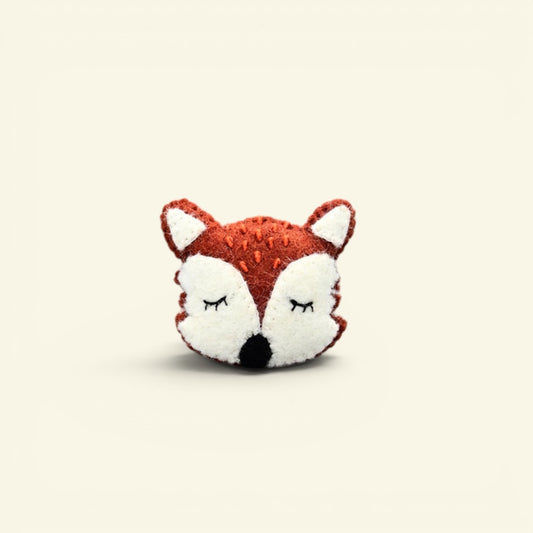 handmade wool felt sleepy fox brooch — orange and cream with closed eyes, needle-felted in nepal, metal pin back