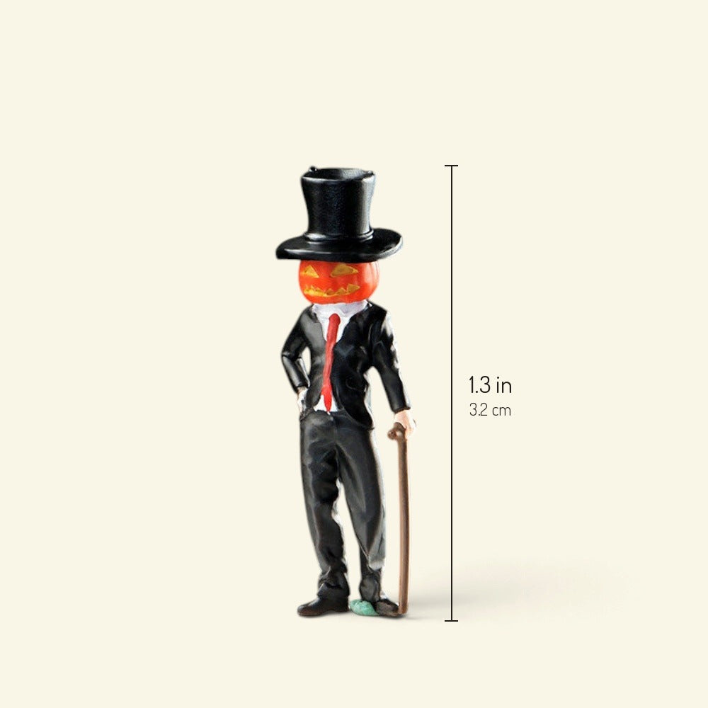 mr. pumpkin, a 1:64 figure in a black suit and top hat with a jack-o'-lantern head and a cane, about 1.3 in / 3.2 cm tall