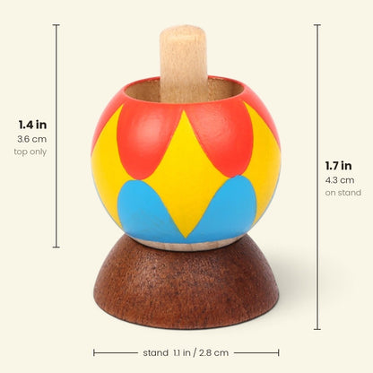 size chart for the harlequin tippe top: top alone 1.4 in / 3.6 cm tall, 1.7 in / 4.3 cm tall on its stand, stand 1.1 in / 2.8 cm across